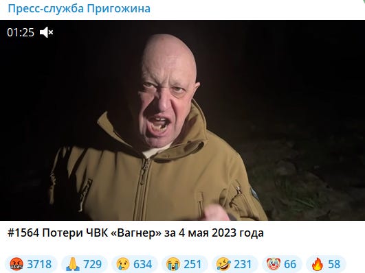 A screenshot of the Telegram video where Yevgeny Prigozhin is standing in a dark field with an angry expression and his hand raised to add emphasis.