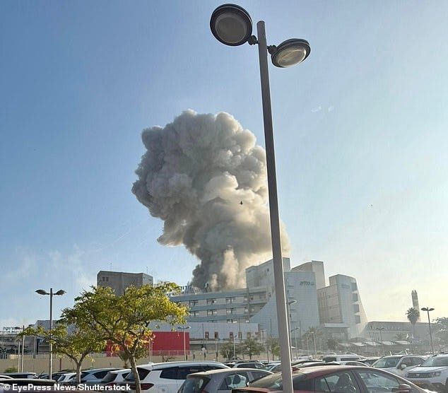 The dramatic developments came on another day of horror as an Iranian ballistic missile struck Soroka Hospital, in Beersheba, which suffered extensive damage. The attack, a direct hit, left 71 injured and saw prime minister Benjamin Netanyahu vowing revenge. Pictured: Smoke billows from a building at Soroka Hospital