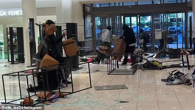 Pictured: An August 2023 robbery of a Nordstrom store in Topanga, California, where the suspects casually walked out with their arms overflowing with merchandise