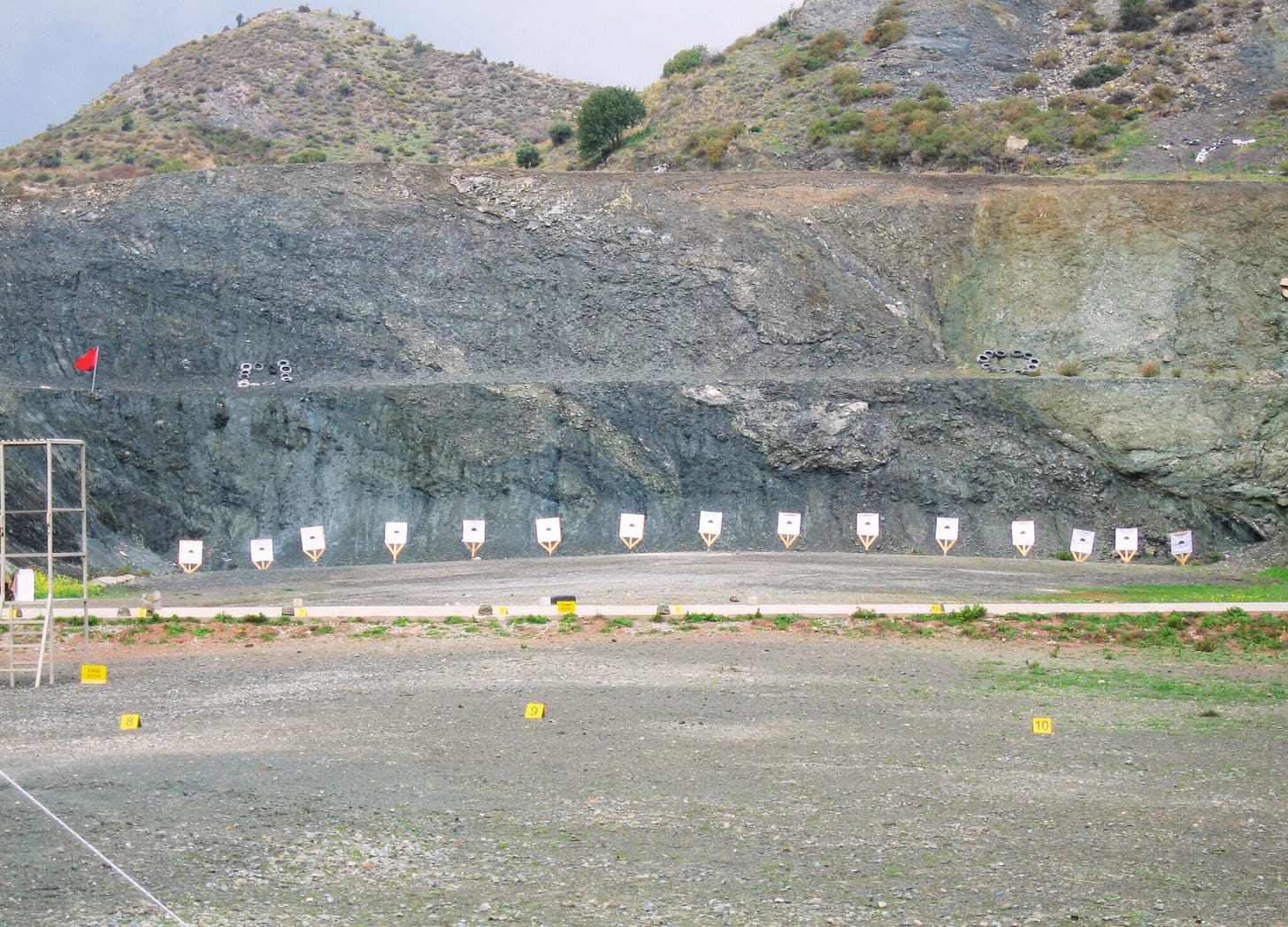 row of targets against a rock face dug out in a hillside