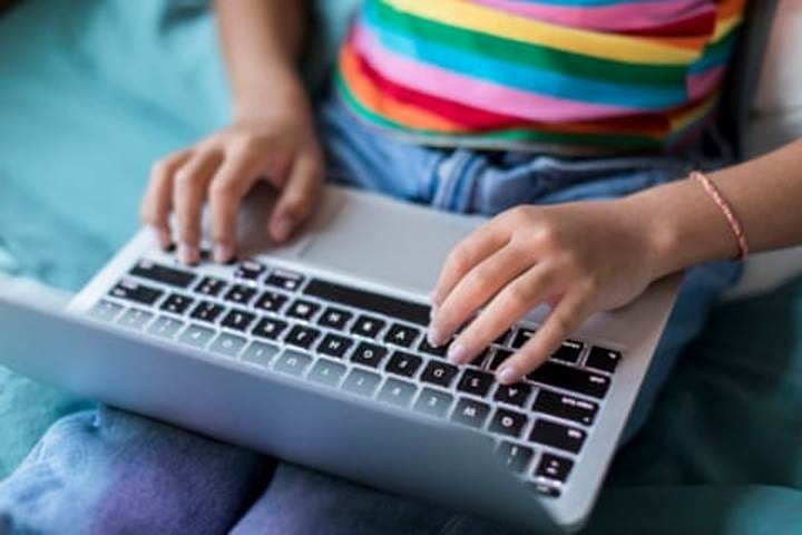 a child uses a laptop