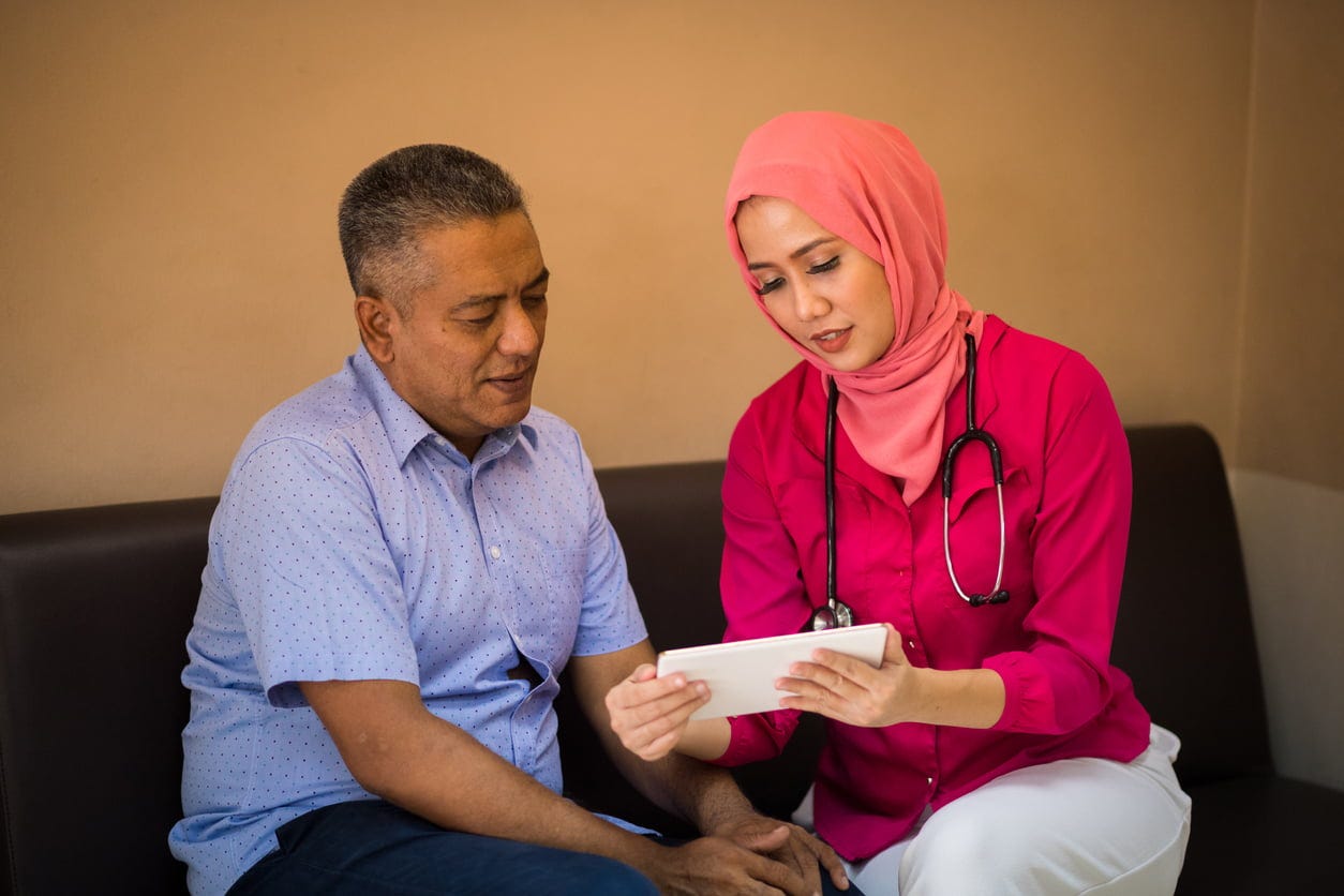 Female Muslim Doctor consulting with a patient - Evidently Cochrane