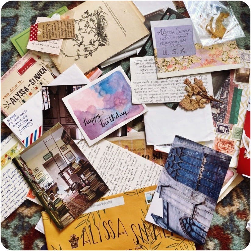 A photo of a collection of handwritten letters, illustrations, cards, paper ephemera and more in a pile.