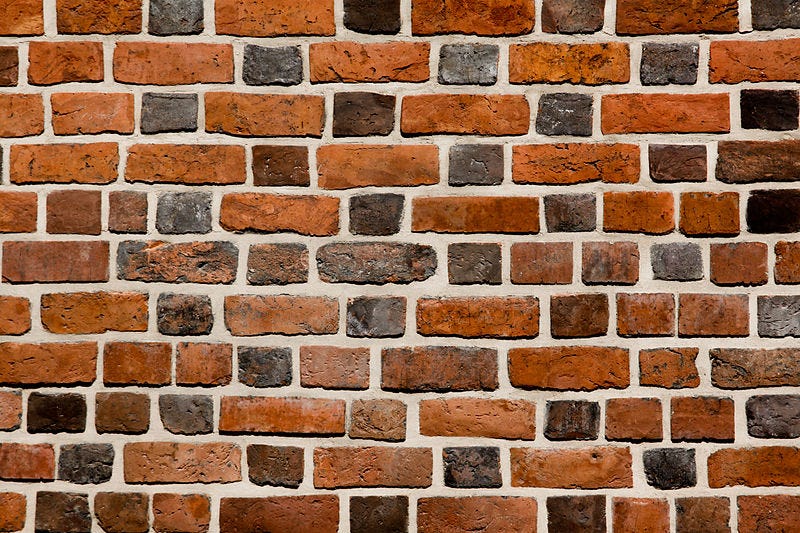 File:Brick wall close-up view.jpg