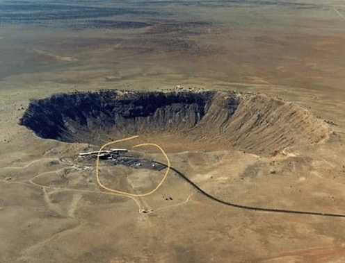 r/funny - an aerial view of a crater with Meteor Crater in the background