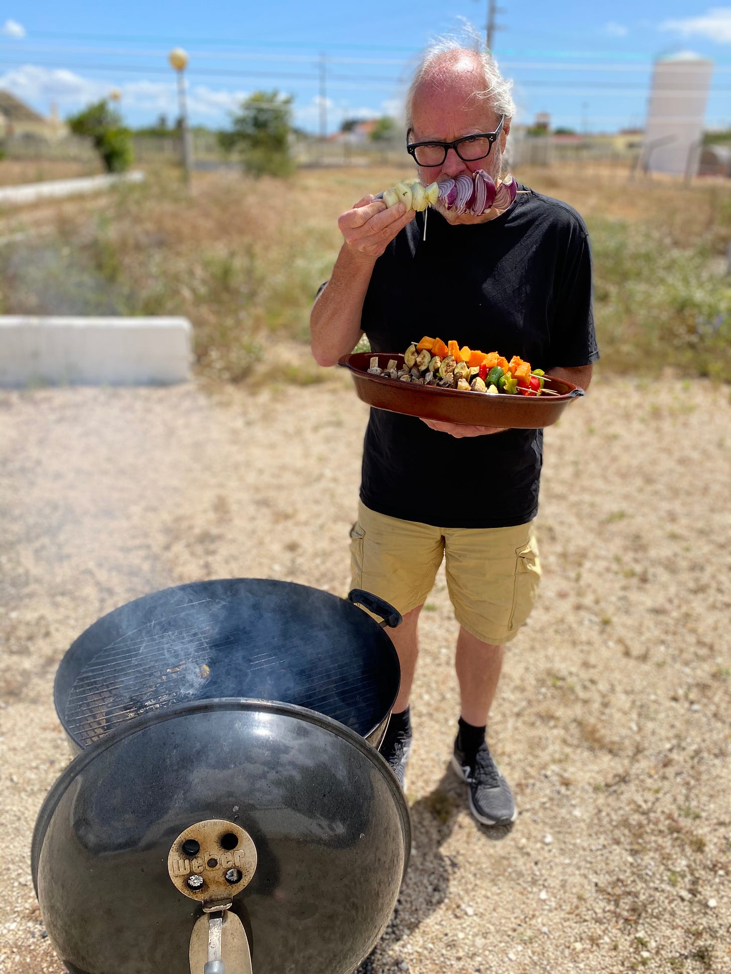 Simon Campbell fooling around with a vegetable kebab outside the Supertone Studio with a kettle BBQ