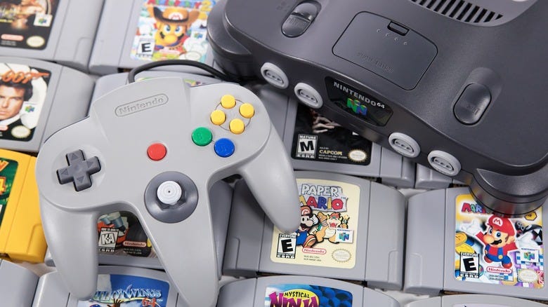 A Nintendo 64 console and controller with game cartridges