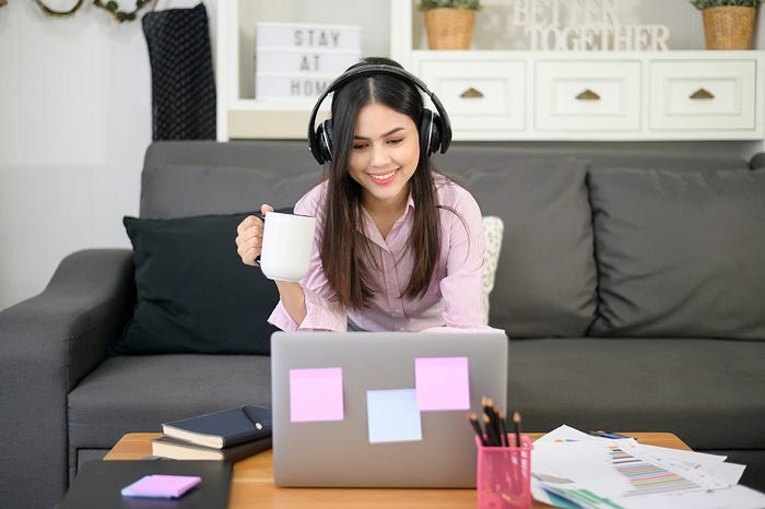 A woman working on a laptop.