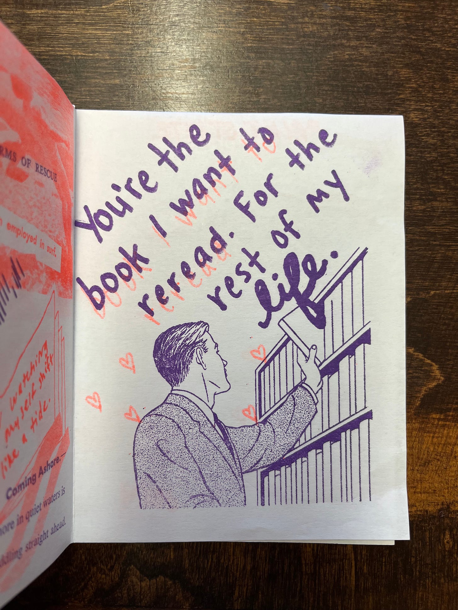 Photo of RISO print image of a man taking a book of a shelf with the words "You're the book I want to reread. For the rest of my life." handwritten on it (by me lol)