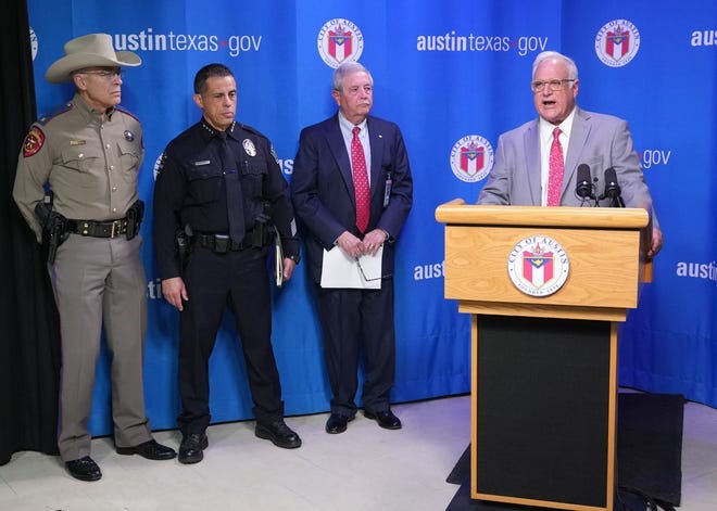 From left, DPS Director Steve McCraw, Austin Police Chief Joe Chacon and interim City Manager Jesús Garza listen to Mayor Kirk Watson speak at the news conference.