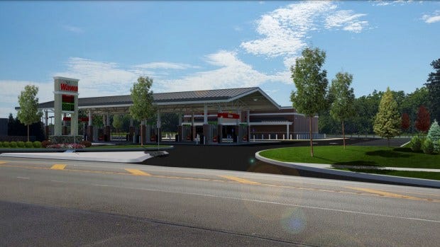 Rendering of a planned new Wawa convenience store with fuel pumps, with driveways leading to and from Valley Forge Road in Upper Gwynedd, as presented during the Nov. 21, 2023 township commissioners meeting. (Screenshot of meeting video)
