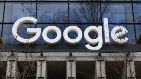 Getty Images A Google corporate logo hangs above the entrance to their office at St. John's Terminal on March 31, 2024, in New York City.