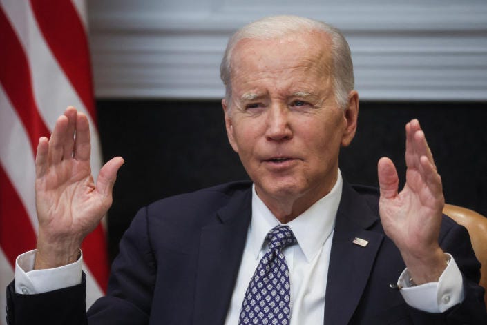  U.S. President Joe Biden speaks with members of his 