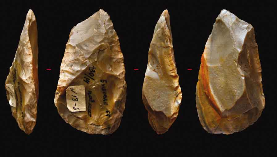 Stone tool from Byzovaya, Russia, in four views
