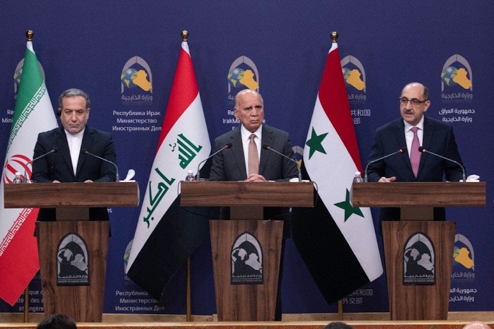 Iraqi Foreign Minister Fouad Hussein, center, Iranian Foreign Minister Abbas Araghchi, left, and Syrian Foreign Minister Bassam Sabbagh, right, hold a press conference in Baghdad, Iraq, Dec. 6, 2024. (AP)