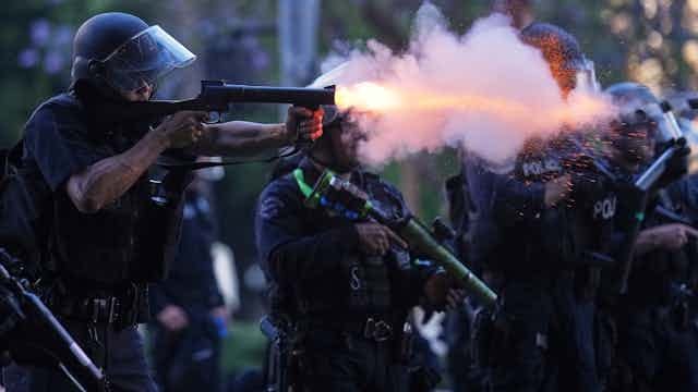 What are the 'less lethal' weapons being used in Los Angeles?