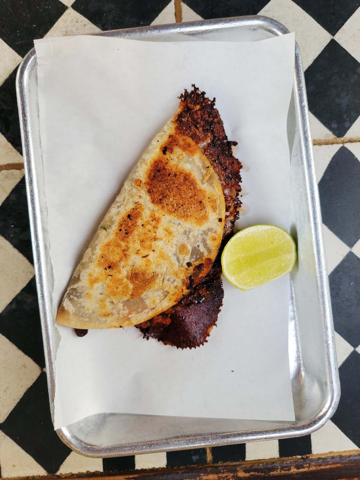 A smoked marlin quesadilla on a tray. 