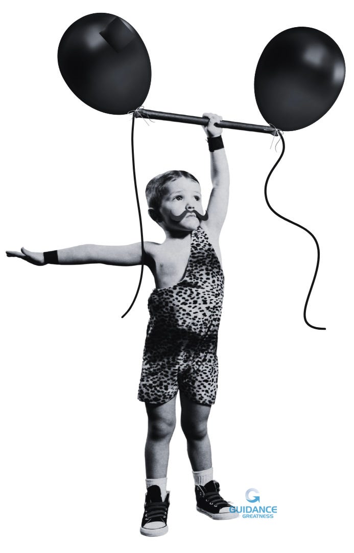 A black and white image of a small White boy dressed in a caveman’s leopard-skin outfit and sneakers. He has a fake handlebar mustache and is hoisting a barbell with his left hand while holding out his right arm. Instead of weights, the barbell has two black balloons on either end with strings dangling down.