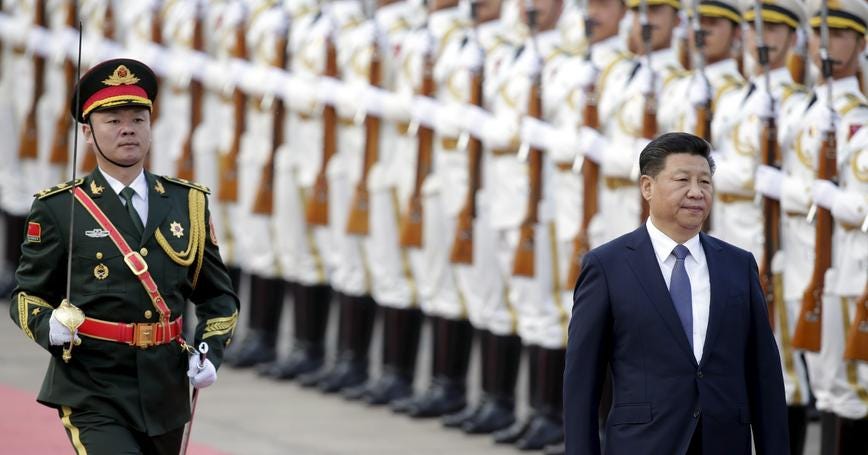 China's President Xi Jinping reviews an honour guard during a welcoming ceremony for Nigerian President Muhammadu Buhari (not pictured) at the Great Hall of the People in Beijing, China, April 12, 2016