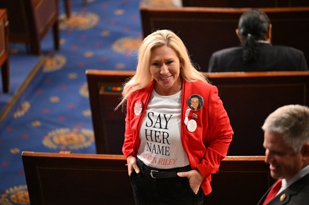 US Representative Marjorie Taylor-Greene (R-GA) wears a shirt and button showing slain Georgia college student Laken Riley