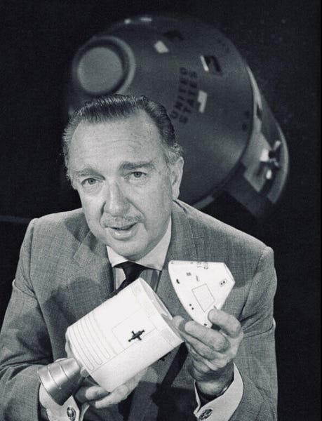 Walter Cronkite of CBS News holds a model of the Apollo Command and Service Modules. (Credit: unknown)