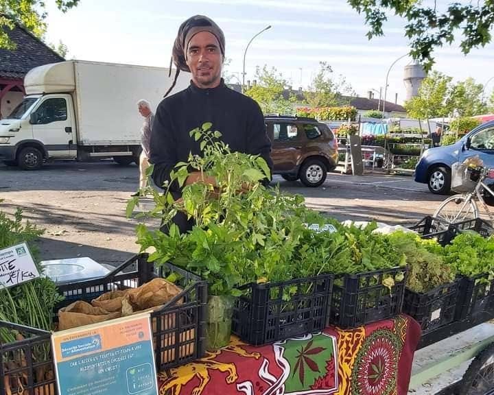 Market gardener with his stall.