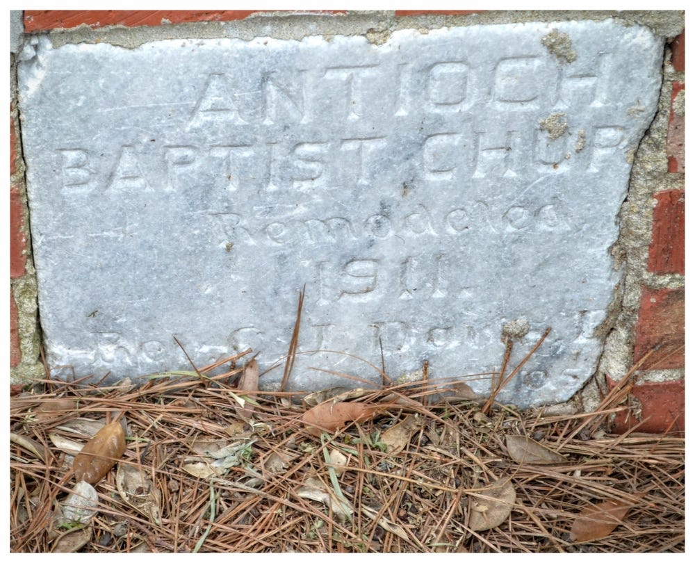Granite marker in the side of the current Antioch Baptist Church building, Mount Meigs, Montgomery County, Alabama
