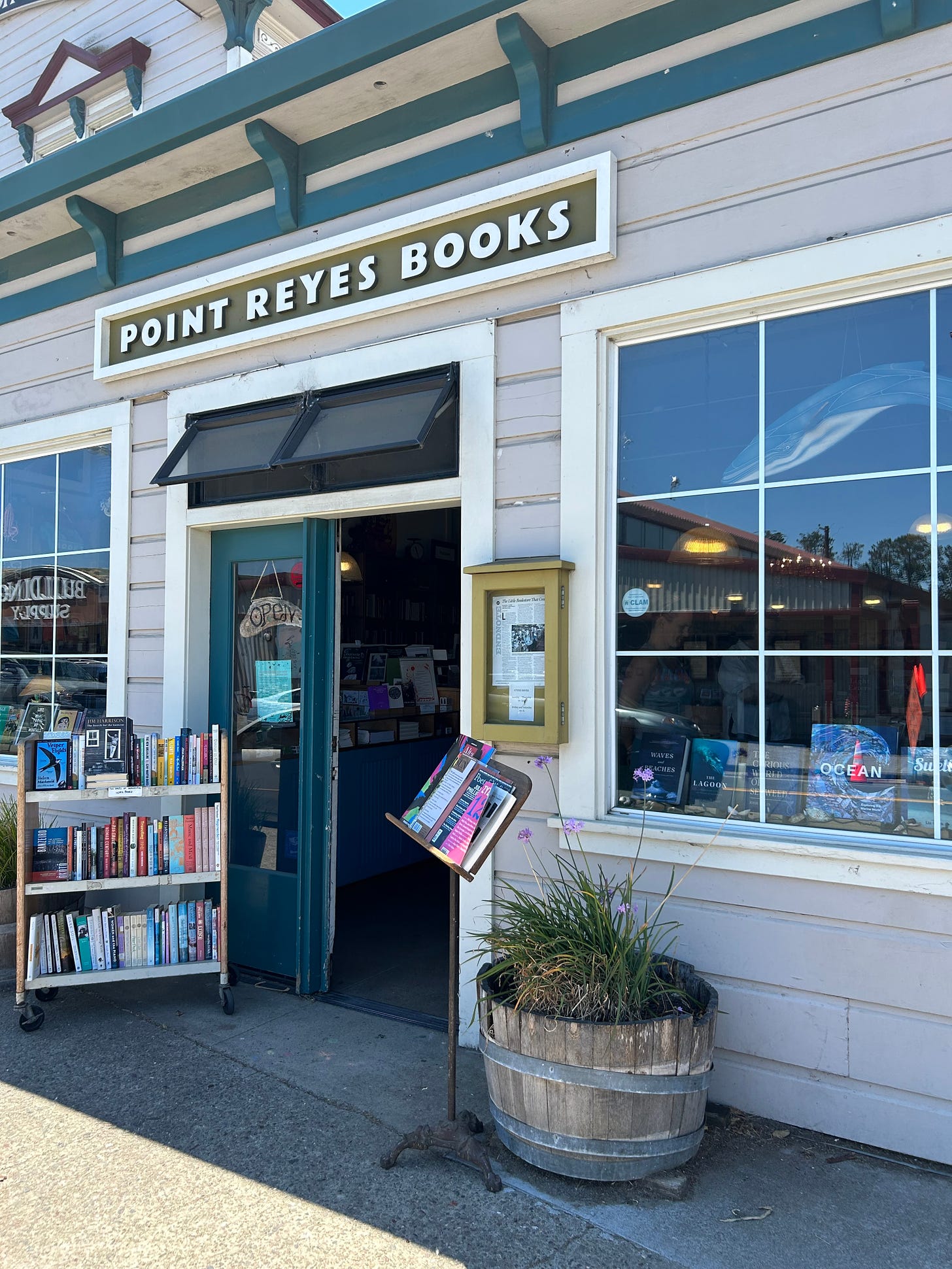 Front of the Point Reyes Bookstore in California with a Green and White Sign