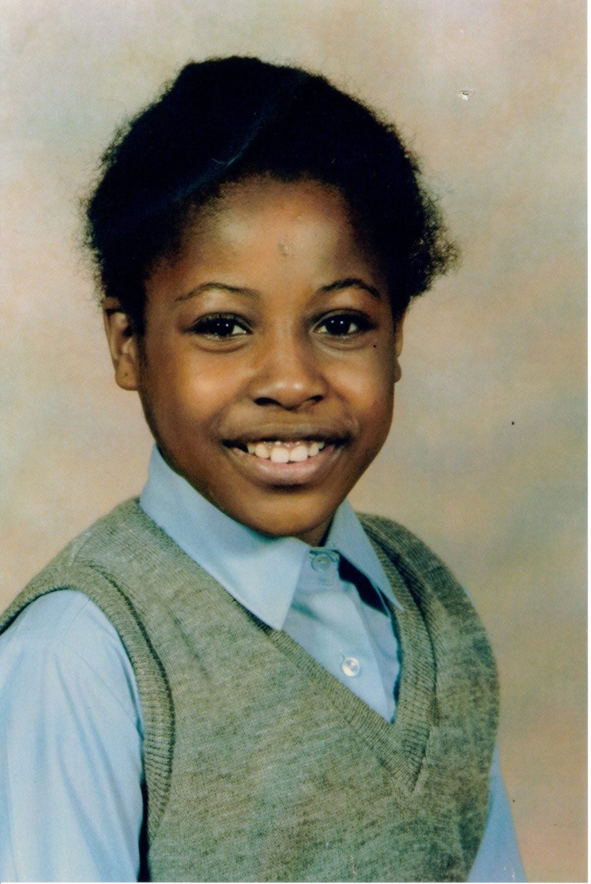 Black schoolgirl in school uniform aged 11 - head and chest