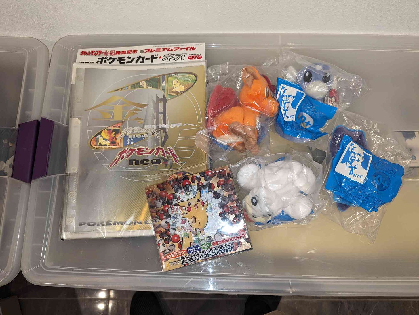 Jaxel kindly shared some photographs of a few items from his Pokémon collection. Here is a picture of his Japanese Neo Genesis Premium File, Pokémon Song Best Collection CD, and all four beanbag plush toys (Dratini, Seel, Vulpix and Zubat) that were purchasable from KFC in 1998
