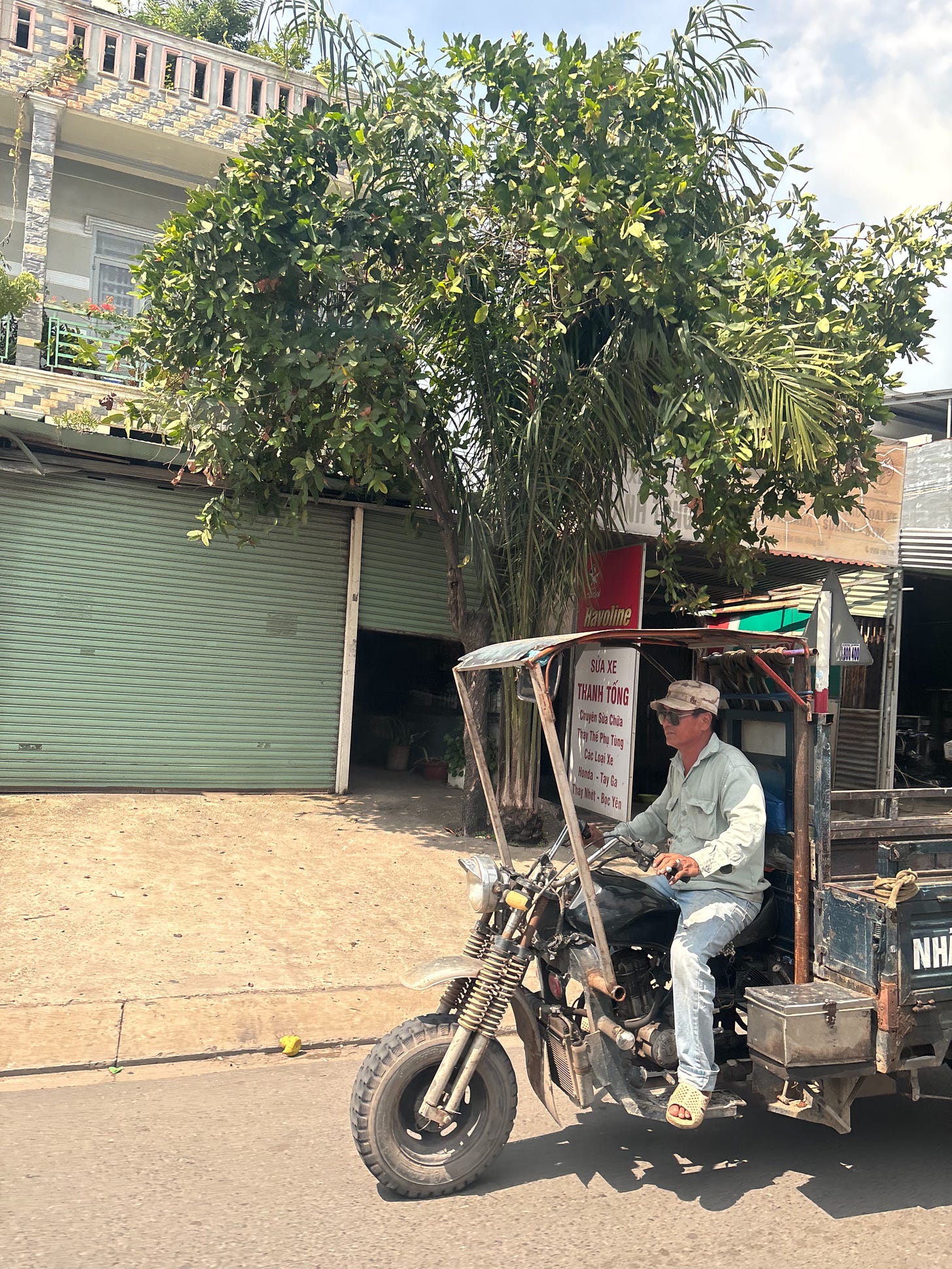 Vietnamese man driving truck on the street