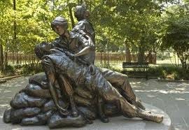 Vietnam war memorial with nurse and wounded soldier.