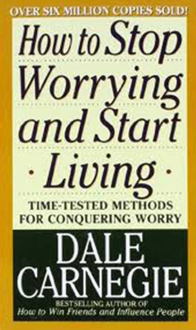 The cover of How to Stop Worrying and Start Living, by Dale Carnegie. The cover is white on top and black on the bottom with a light brown trim. 