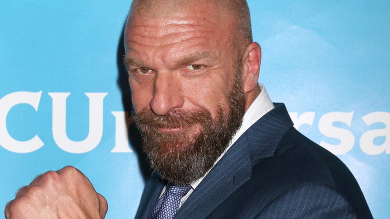 Triple H posing at a promotional event 