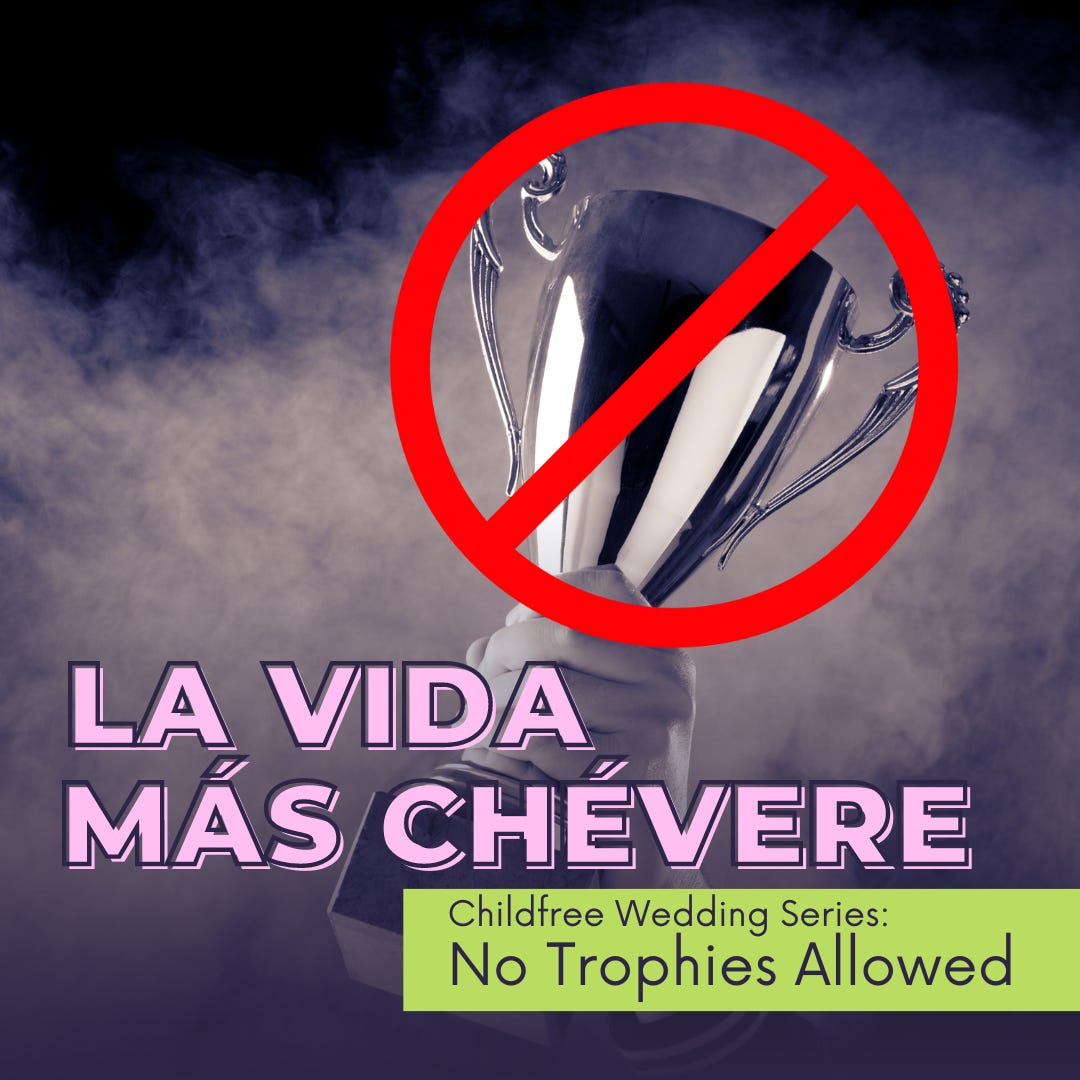 Hand holding a trophy with a not allowed graphic slapped over top, text reads La Vida Más Chévere Childfree Wedding Series: No Trophies Allowed