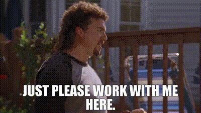 A man with a long brown mullet saying, "just please work with me here" in a grassy backyard that needs to be mowed.