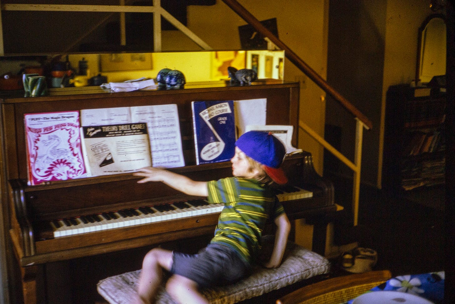 Picture of me as a child at our upright piano