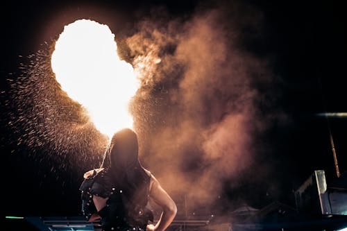 Free Person Standing Beside Fire during Night Time Stock Photo