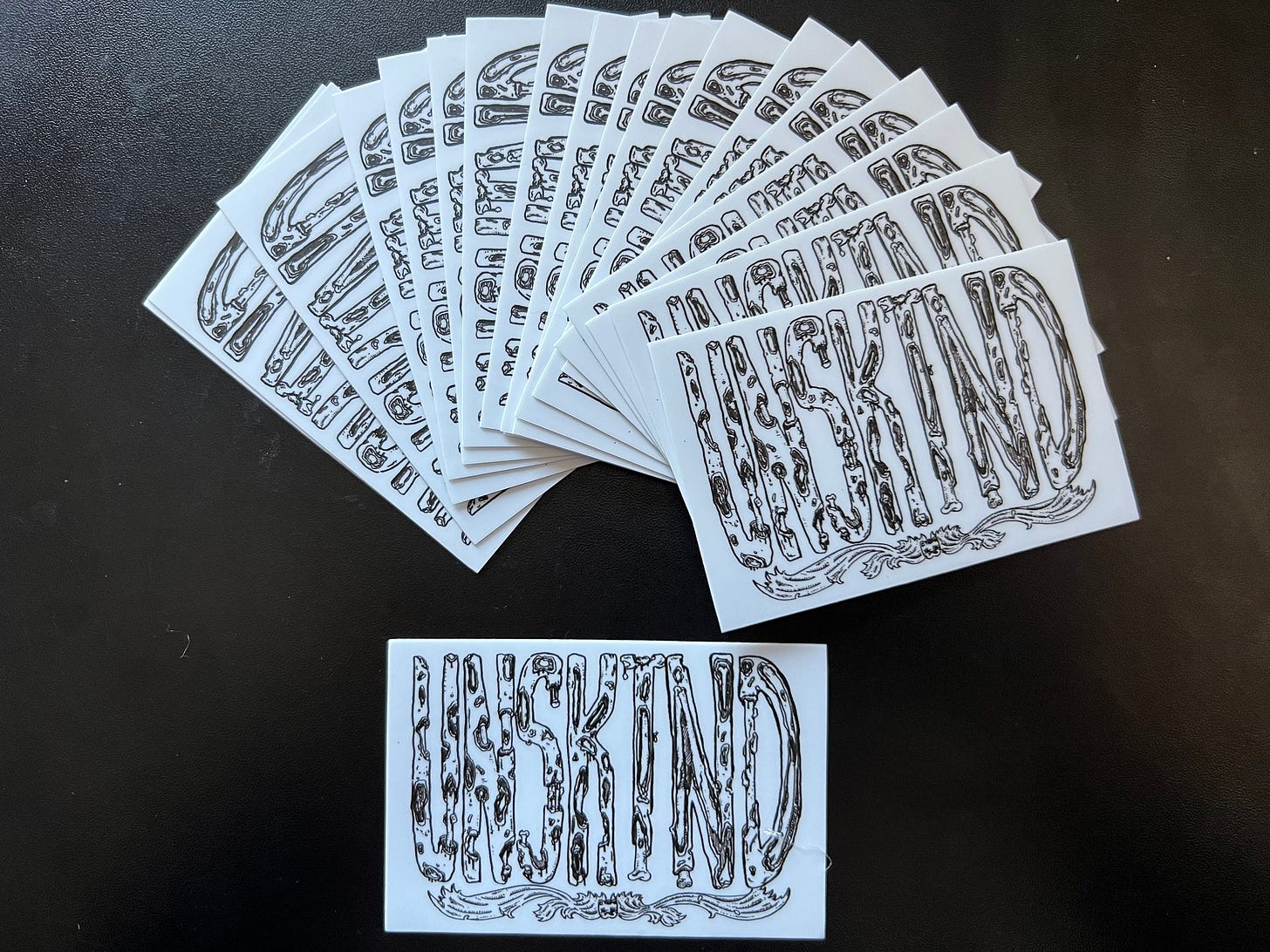 an array of UNSKIND stickers! Designed by our own Chris Winter