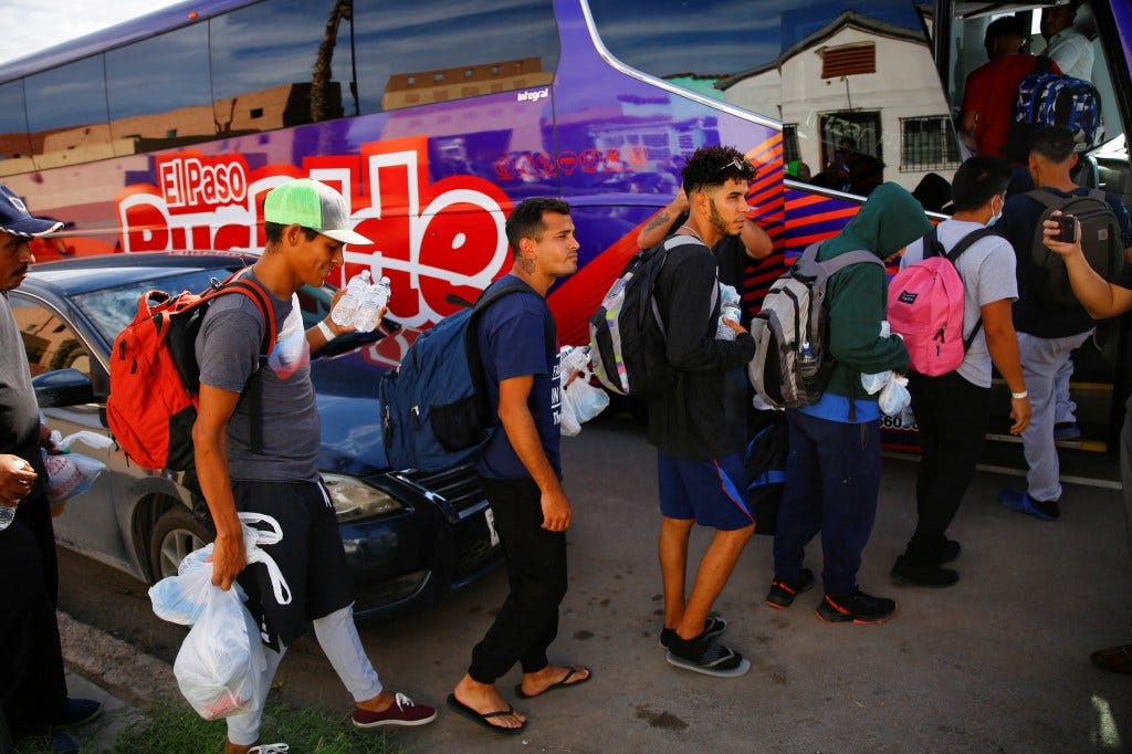 Migrants from Venezuela board a bus to New York City after being released from U.S. border patrol custody in El Paso, Texas.