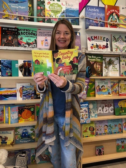 Photo of Laurie with her books