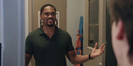 Walker Coach Trey walking in looking at Colton in boys locker room.