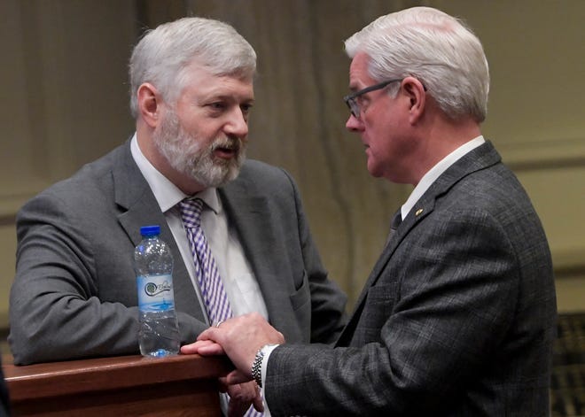 Sen. Will Barfoot, left, talks with Sen. Greg Reed in the senate chamber at the Alabama Statehouse in Montgomery, Ala., on Wednesday March 6, 2024.