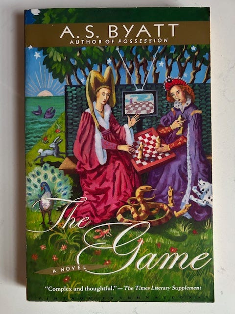 Two women sit at a chessboard on the cover of The Game by A.S. Byatt