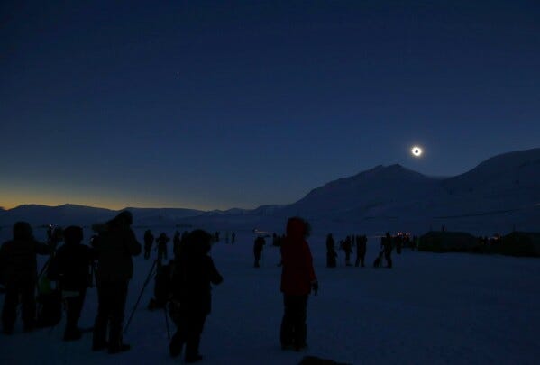 FILE - People watch the total solar eclipse from Svalbard, Norway on Friday March 20, 2015. (Haakon Mosvold Larsen/NTB Scanpix via AP, File)