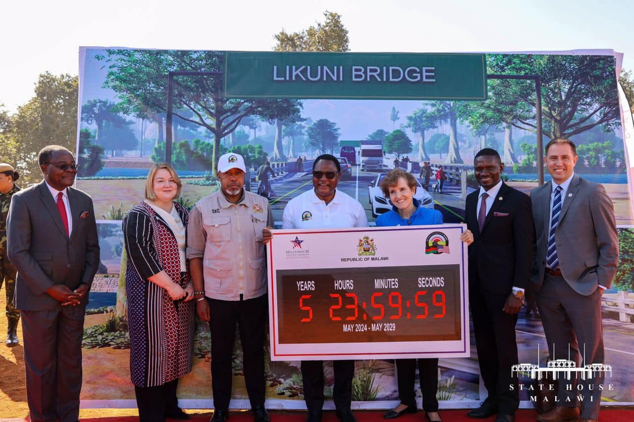 May be an image of 8 people and text that says 'LIKUNIBRIDGE LIKUNI BRIDGE N MAETSRAM REPURLICOFMALAM REPUBLIC MALAW YEARS HOURS MINUTES SECONDS 5 23:59:59 MAY 2024- MAY2024-MAY2029 MA MAY 2029 ርዴትም අරරනන් 모늘있도 STATEHOUSE'