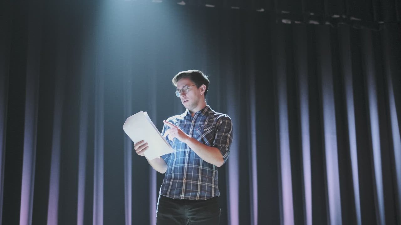 Actor reading his script on stage - Free Stock Video