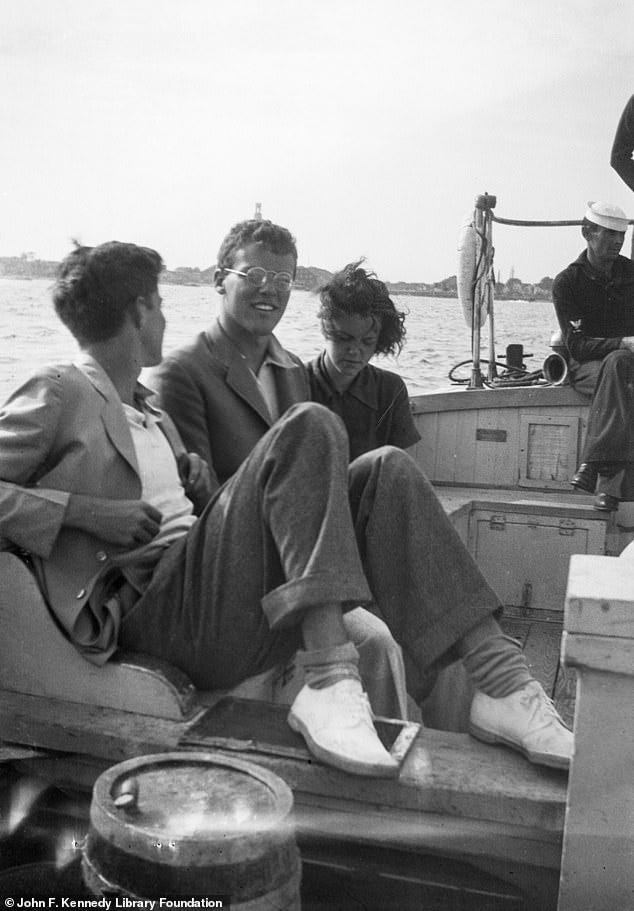 Jack and Lem sit aboard a boat off the coast of Hyannis Port, Massachusetts in July 1933, along with an unidentified girl.