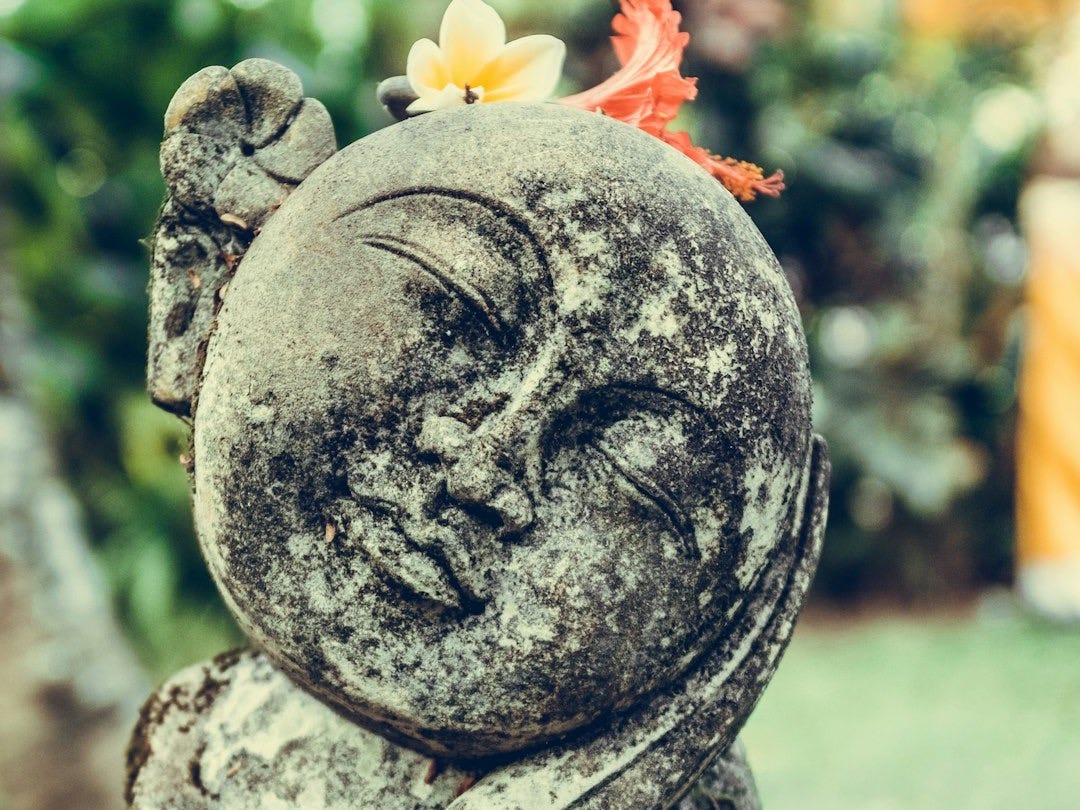 selective focus photography of statue