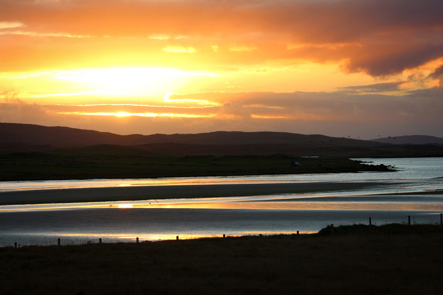 sunset over inlet & hills on north uist